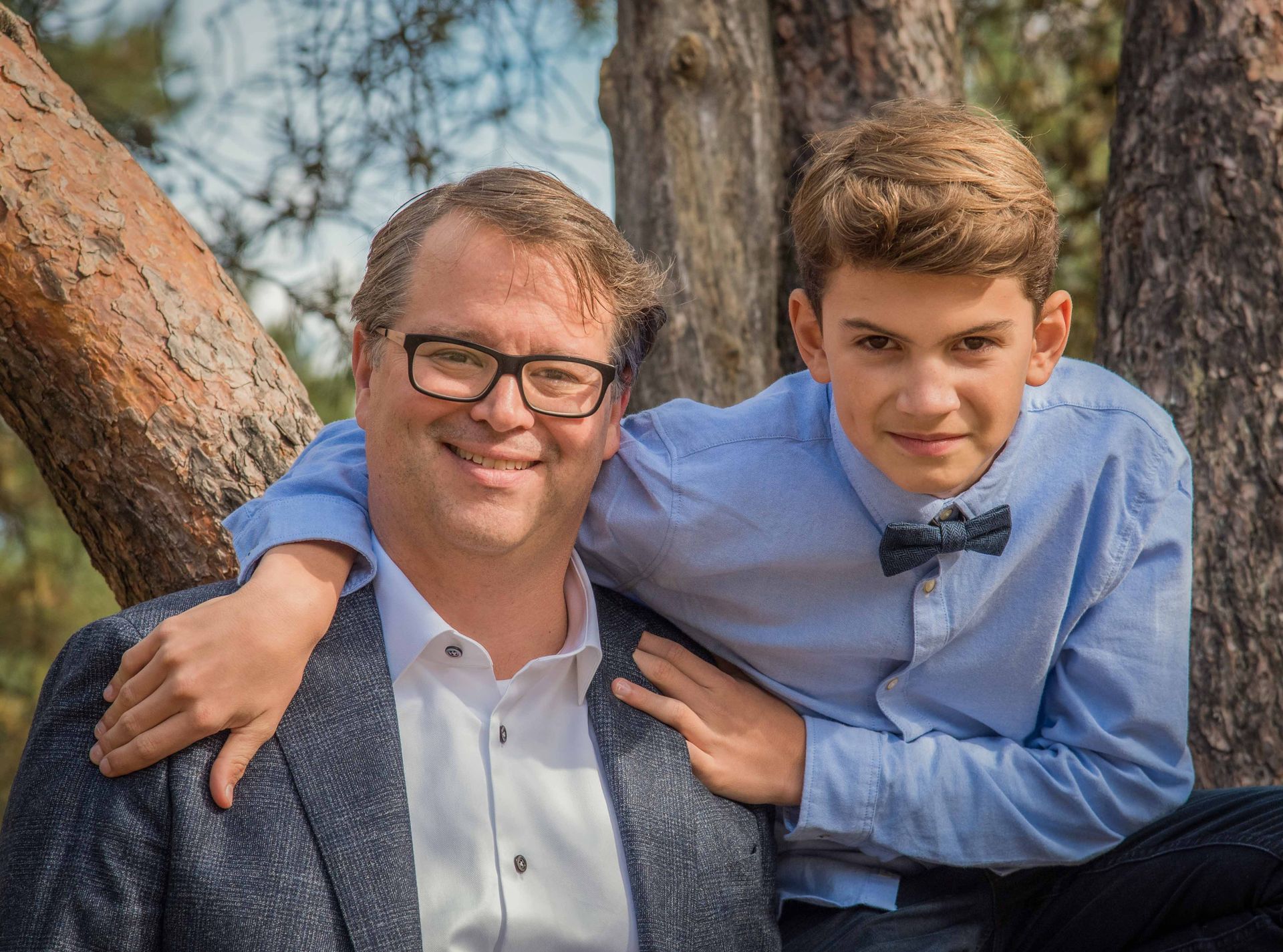 A father and son in a happy family moment. Portrait is taken outdoors 